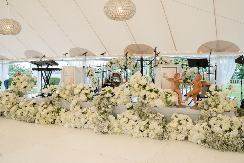 floral covered band area at reception