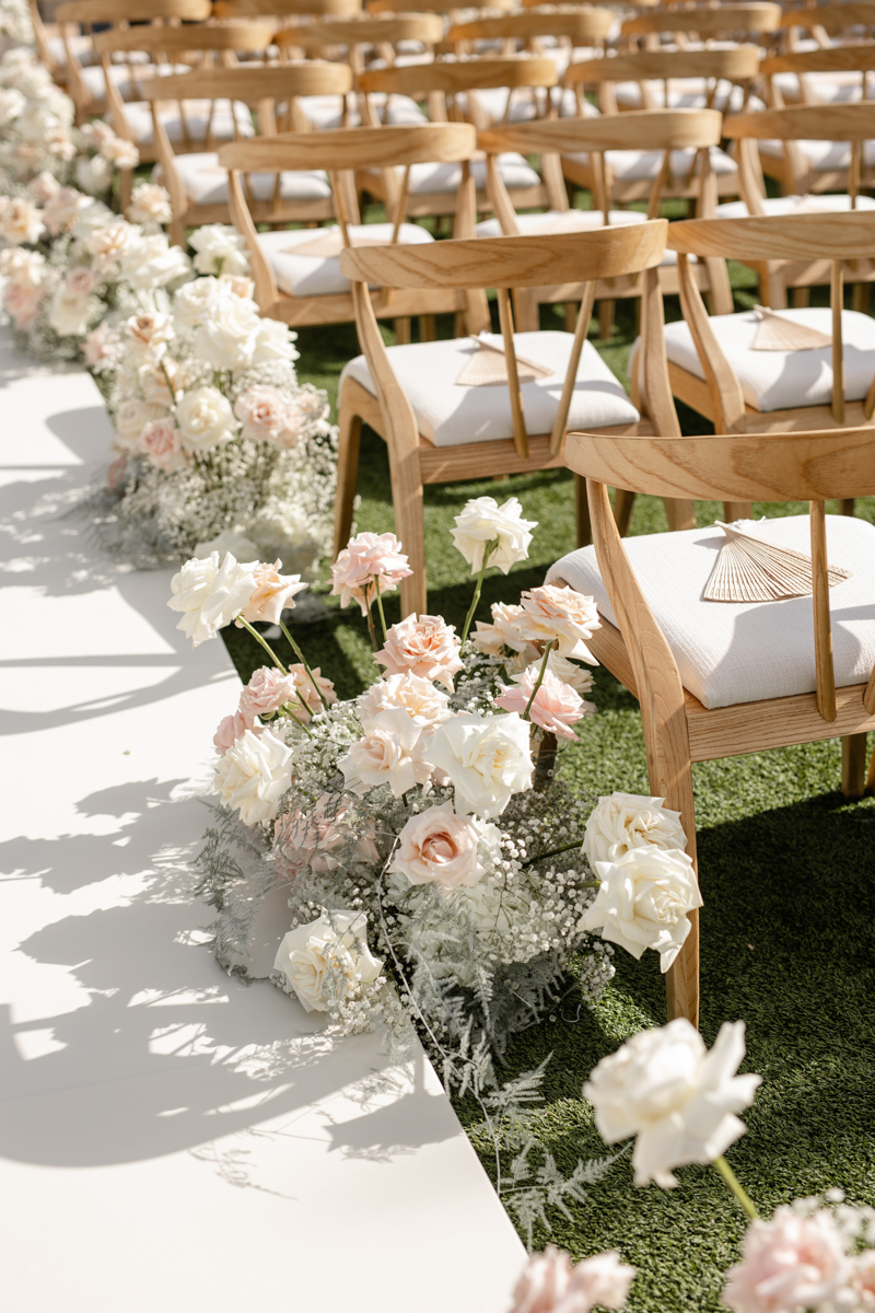 white and pink floral ceremony
