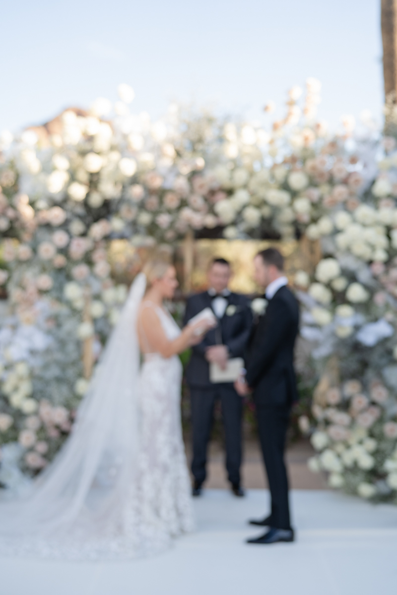 white and pink floral wedding ceremony at omni