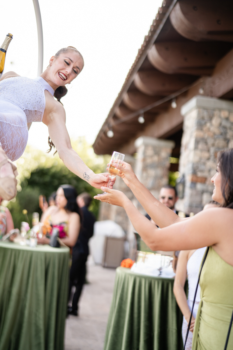 aerialist champagne pourer at wedding