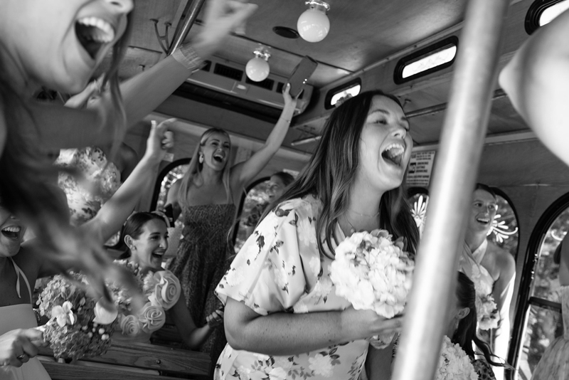 bridesmaids singing on trolley