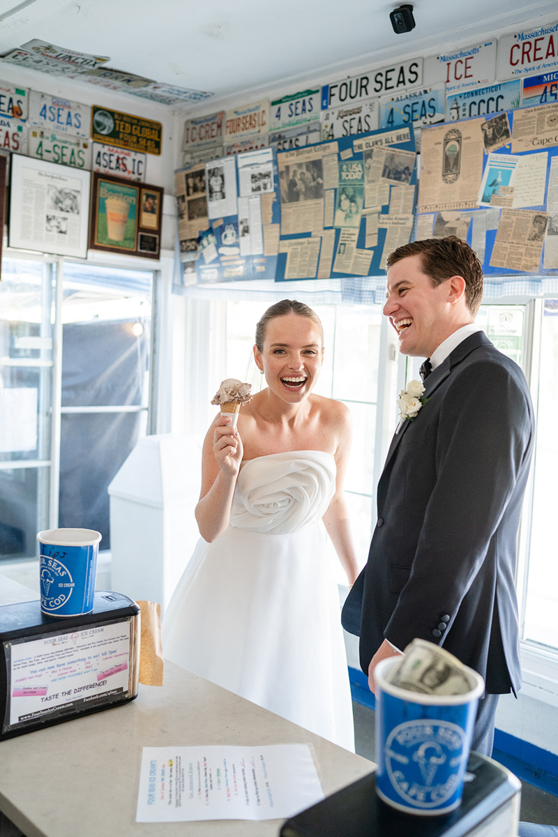 bride and groom eating ice cream cone at Four Seas Ice Cream Cape Cod