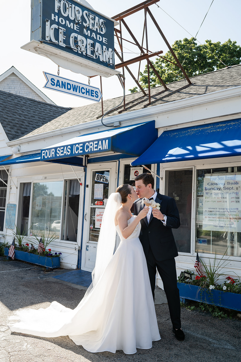 bride and groom eating ice cream cone at Four Seas Ice Cream Cape Cod