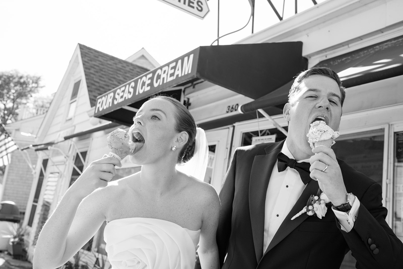 bride and groom eating ice cream cone at Four Seas Ice Cream Cape Cod