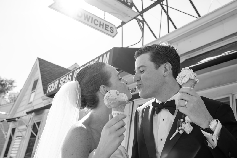 bride and groom eating ice cream cone at Four Seas Ice Cream Cape Cod