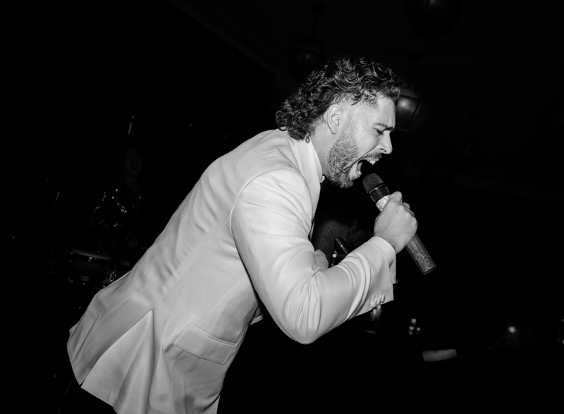 groom singing at wedding